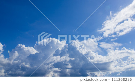 Cumulonimbus clouds appearing in the blue sky 111268256