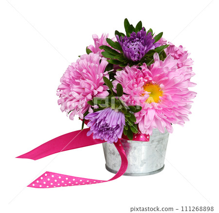Pink and purple aster flowers in a small metal bucket isolated on white background 111268898