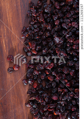 Dehydrated blueberries on wood surface. Natural food background 111269197