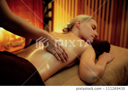 Caucasian woman customer enjoying relaxing anti-stress massage. Quiescent 111269430