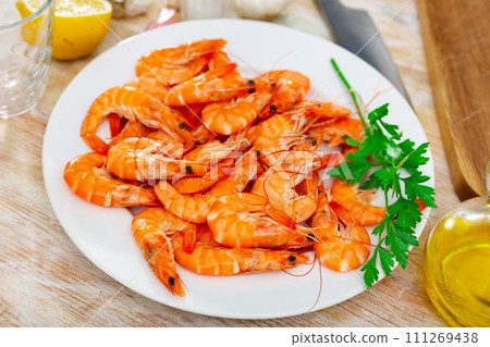 Seafood appetizer. Roasted langostins served with parsley Seafood appetizer. Roasted langostins served with parsley 111269438