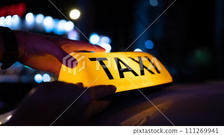 Taxi sign light on the street 111269941