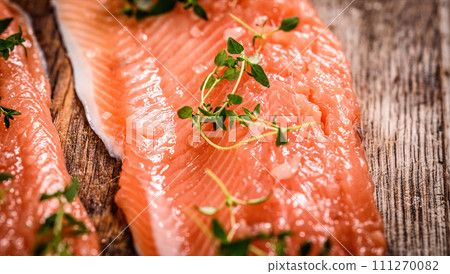 fillet of trout red fish with herbs and salt 111270082