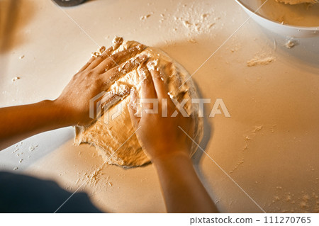 hands preparing dough for pizza. hands preparing dough for pizza. 111270765