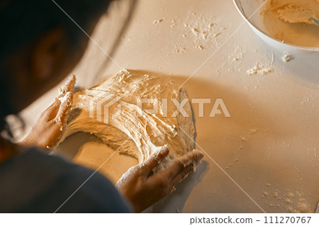 hands preparing dough for pizza. hands preparing dough for pizza. 111270767