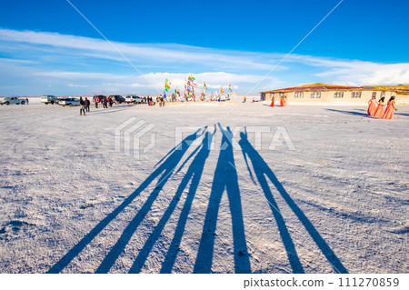 Shadow of four people on white surface 111270859