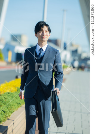 young man wearing a suit 111271066