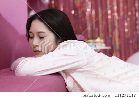 young woman dozing in the room 111271118