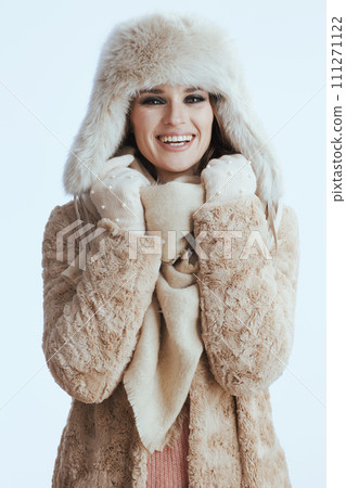 happy woman in winter coat and fur hat on white happy woman in winter coat and fur hat on white 111271122