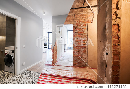 Comparison of old apartment before restoration and new renovated flat with modern interior design. Apartment with underfloor heating pipes and washing machine in bathroom before and after renovation. Comparison of old apartment before restoration and new renovated flat with modern interior design. Apartment with underfloor heating pipes and washing machine in bathroom before and after renovation. 111271131