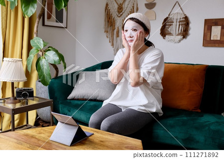 A woman doing self-skin care at home A woman doing self-skin care at home 111271892