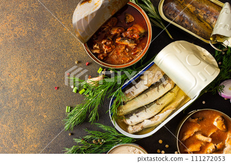 Open tin cans with canned fish Open tin cans with canned fish 111272053