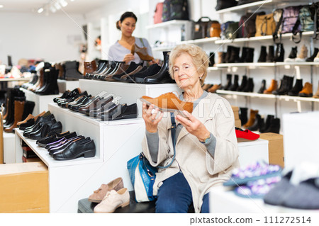 Mature european woman is going to try on shoes Mature european woman is going to try on shoes 111272514