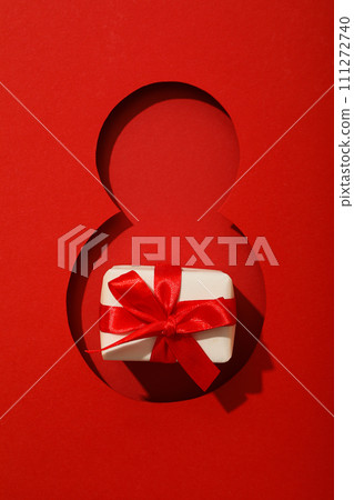 Number eight cut out of paper on a red background Number eight cut out of paper on a red background 111272740