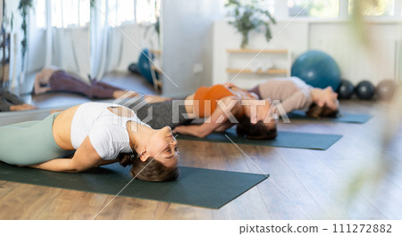 Group of women doing stretching in studio 111272882
