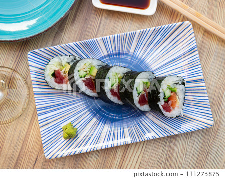 Japanese roll futomaki with soy sauces Japanese roll futomaki with soy sauces 111273875