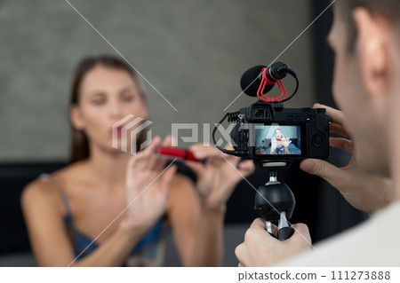 Young woman making beauty and cosmetic tutorial video content. Unveiling Young woman making beauty and cosmetic tutorial video content. Unveiling 111273888