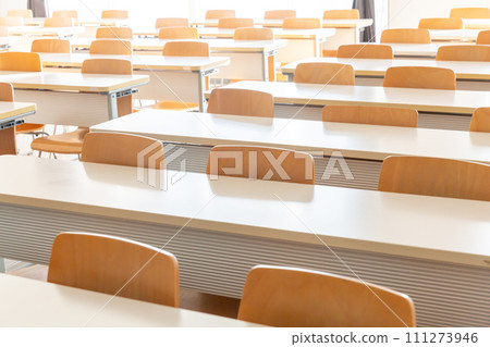 Desks and chairs lined up indoors classroom conference room university Desks and chairs lined up indoors classroom conference room university 111273946