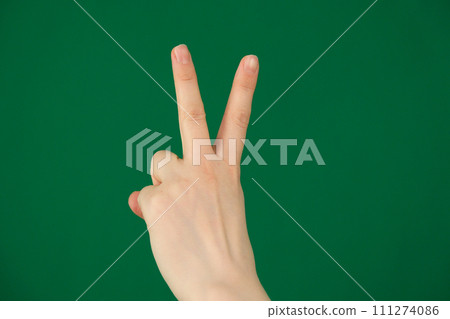Handsign Victory Backside. Isolated expression of emotions with hands unrecognizable people hands palms fingers close-up on a green background chromakey feelings Handsign Victory Backside. Isolated expression of emotions with hands unrecognizable people hands palms fingers close-up on a green background chromakey feelings 111274086