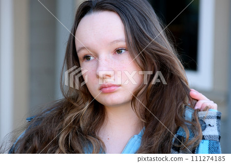 Portrait of a teen girl looking sad and troubled 111274185