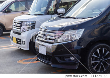 Cars lined up in a shopping mall parking lot 111274188