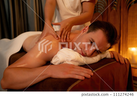 Caucasian man customer enjoying relaxing anti-stress massage. Quiescent 111274246