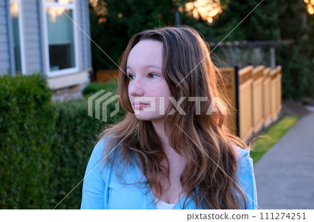 Beautiful girl on the grass with blue eyes looking at Beautiful girl on the grass with blue eyes looking at 111274251