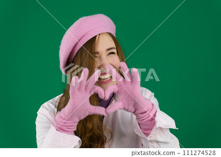 show heart with hands laughing happy girl jokes gets pleasure pink winter knitted gloves on hands show heart with hands laughing happy girl jokes gets pleasure pink winter knitted gloves on hands 111274528