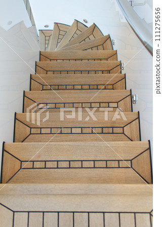 Teak wood deck ladder. Wooden deck on super yacht. Yachting concept. Teak wood deck ladder. Wooden deck on super yacht. Yachting concept. 111275656