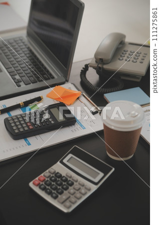 Business team meeting working with new startup project, discussion and analysis data the charts and graphs. Digital tablet, calculator, laptop computer using, Business finance and accounting concept. Business team meeting working with new startup project, discussion and analysis data the charts and graphs. Digital tablet, calculator, laptop computer using, Business finance and accounting concept. 111275861