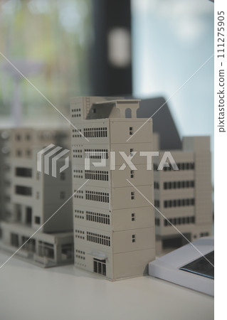 Close-up at tablet, Engineers pointing at tablet with their hands. To jointly design the use of renewable energy with wind and solar energy. Concept of using renewable energy. Close-up at tablet, Engineers pointing at tablet with their hands. To jointly design the use of renewable energy with wind and solar energy. Concept of using renewable energy. 111275905