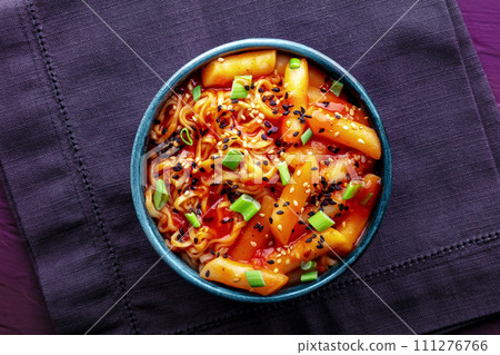 Rabokki, tteokbokki or topokki with ramen, Korean street food, spicy rice cakes 111276766