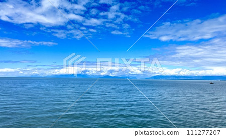 blank for advertising travel on cruise liners on boats or yachts beautifully visible water Blue horizon Clear sky and calm sea on the Pacific Ocean or lake Canada to Vancouver Island Ferry blank for advertising travel on cruise liners on boats or yachts beautifully visible water Blue horizon Clear sky and calm sea on the Pacific Ocean or lake Canada to Vancouver Island Ferry 111277207
