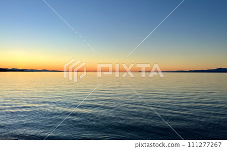 Beautiful sunset on the sea beach bright orange red coastline skyline Beautiful sunset on the sea beach bright orange red coastline skyline 111277267