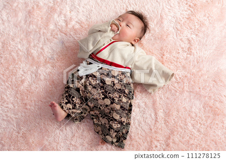Infant boy wearing a kimono Infant boy wearing a kimono 111278125