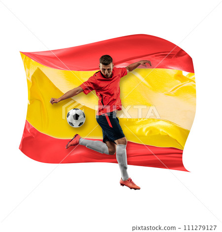 Concentrated man, soccer player in uniform playing, hitting ball against white background with flag of Spain Concentrated man, soccer player in uniform playing, hitting ball against white background with flag of Spain 111279127