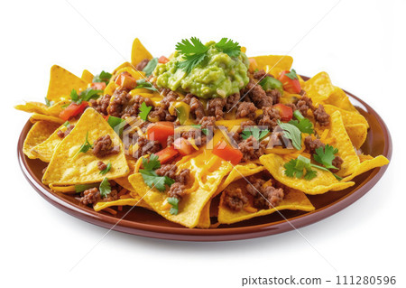 Mexican nachos with beef, guacamole, cheese sauce, peppers, tomato and onion in plate isolated on white background 111280596