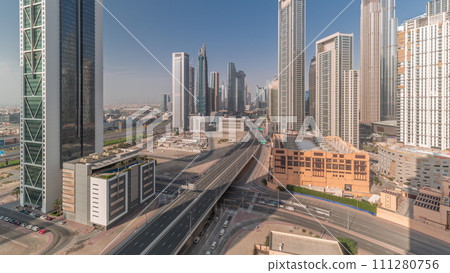 Aerial view of Dubai Downtown skyline with many towers all day timelapse. Aerial view of Dubai Downtown skyline with many towers all day timelapse. 111280756