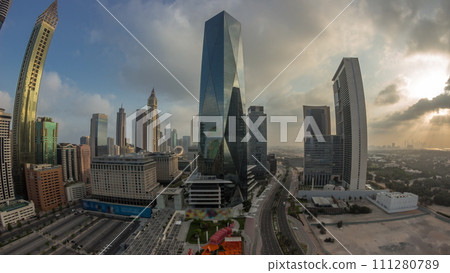 Panorama of Dubai International Financial district aerial night to day timelapse. View of business office towers. Panorama of Dubai International Financial district aerial night to day timelapse. View of business office towers. 111280789