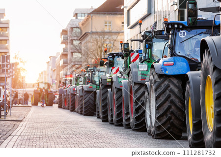 Farmers union protest strike against government Policy in Germany Europe. Tractors vehicles blocks city road traffic. Agriculture farm machines Magdeburg central Domplatz square 111281732