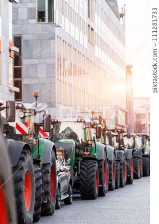 Farmers union protest strike against government Policy in Germany Europe. Tractors vehicles blocks city road traffic. Agriculture farm machines Magdeburg central Domplatz square 111281733