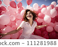 A Symphony of Joy: Young Woman Releasing Myriad Pink Balloons in a Spirited Celebration of Happiness 111281988