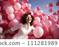 A Symphony of Joy: Young Woman Releasing Myriad Pink Balloons in a Spirited Celebration of Happiness 111281989