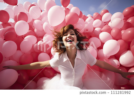A Symphony of Joy: Young Woman Releasing Myriad Pink Balloons in a Spirited Celebration of Happiness 111281992