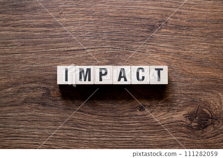 Impact - word concept on building blocks, text 111282059