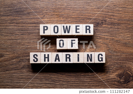Power of sharing - word concept on building blocks, text 111282147