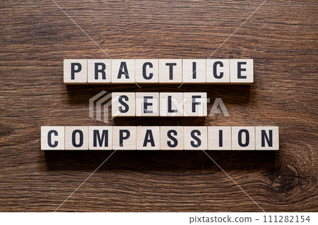 Practice self compassion - word concept on building blocks, text Practice self compassion - word concept on building blocks, text 111282154