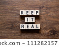 Keep it real - word concept on building blocks, text 111282157
