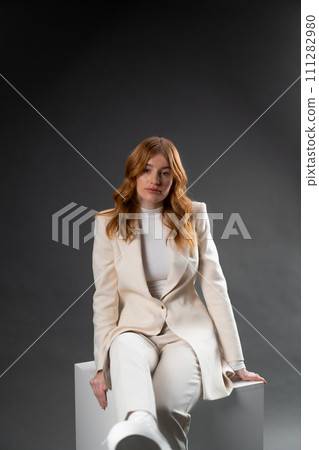 Beautiful smiling woman with perfect makeup looking at camera on black background Beautiful smiling woman with perfect makeup looking at camera on black background 111282980