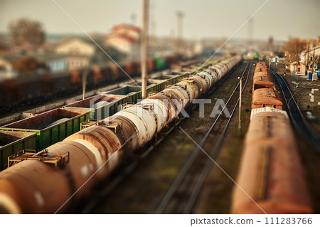 Freight railway cars at the railway station. Top view of cargo trains.Wagons with goods on railroad. Heavy industry. Industrial conceptual scene with trains. selective focus 111283766